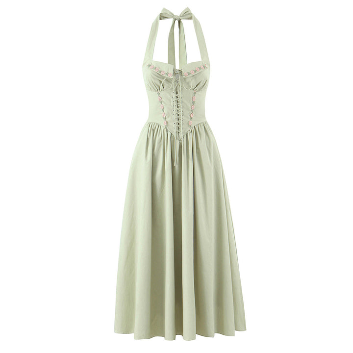 Jenia midi dress with a neck tie, open back, and floral embroidery