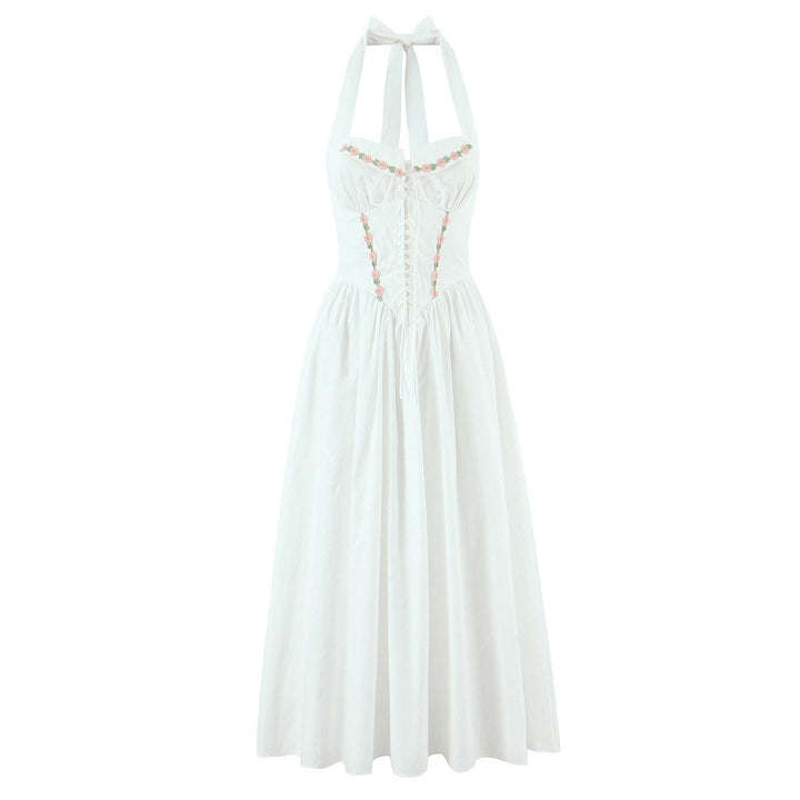 Jenia midi dress with a neck tie, open back, and floral embroidery
