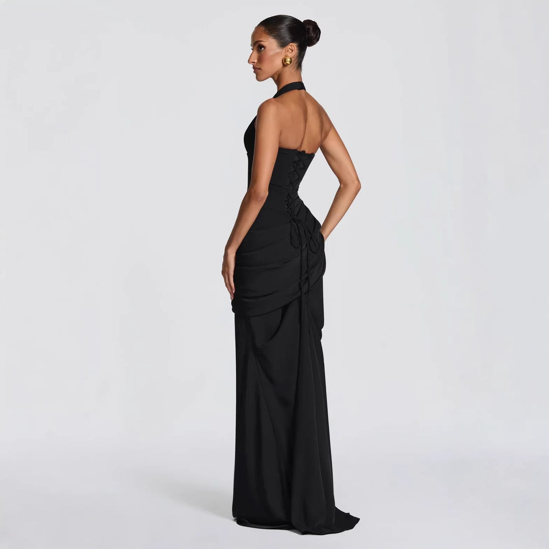 Erin maxi dress with an open back, a back tie for a fitted waist, and a pleated design