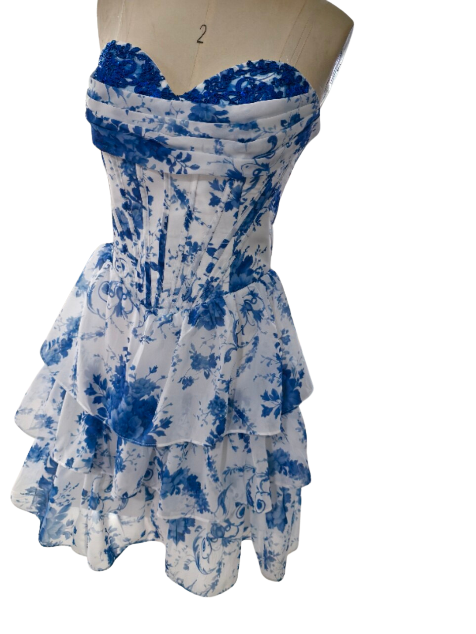 SHERY strapless mini dress with tiered ruffles, corset design, back tie, and waist-cinching fit