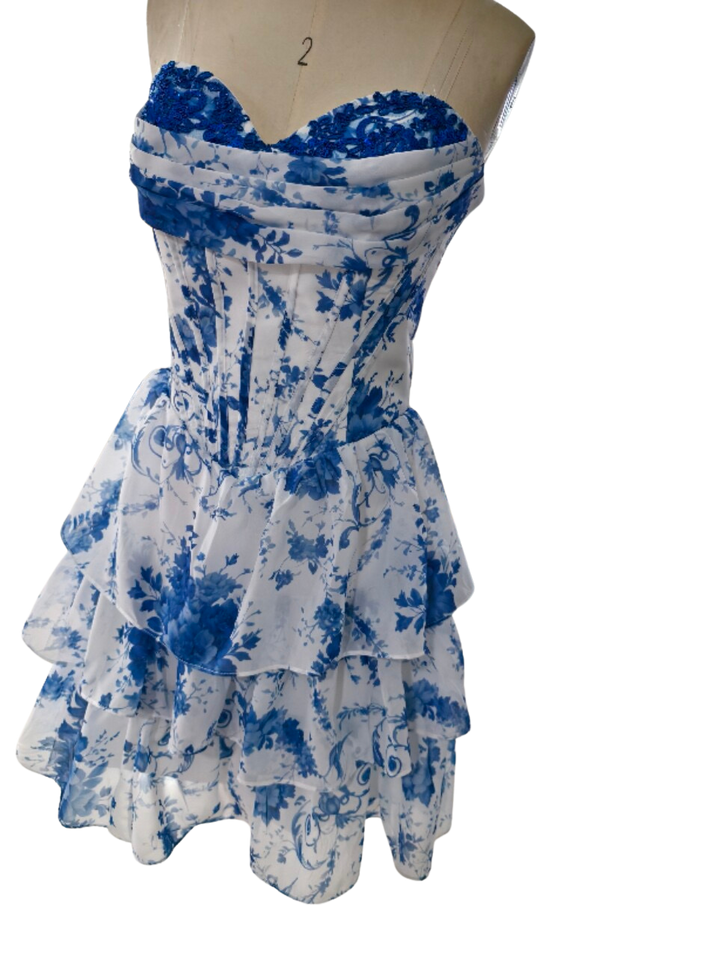 SHERY strapless mini dress with tiered ruffles, corset design, back tie, and waist-cinching fit