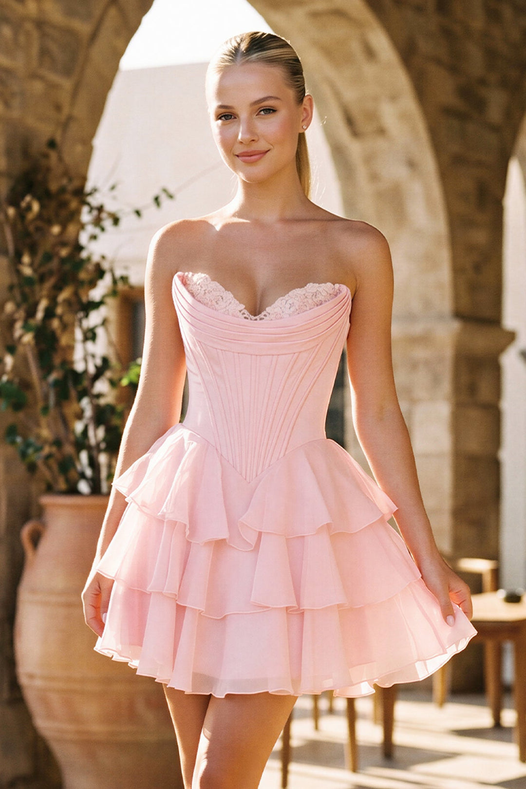 SHERY strapless mini dress with tiered ruffles, corset design, back tie, and waist-cinching fit