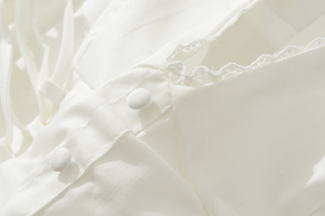A-line mini dress with tie and button embellishments – Vanessa