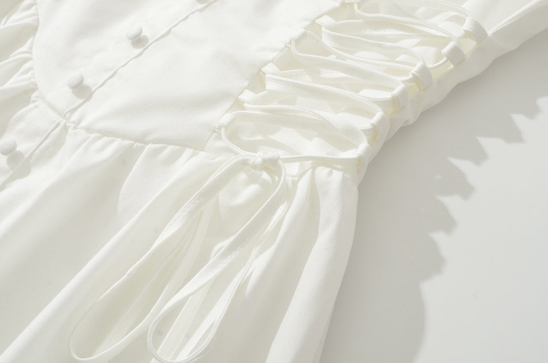 A-line mini dress with tie and button embellishments – Vanessa