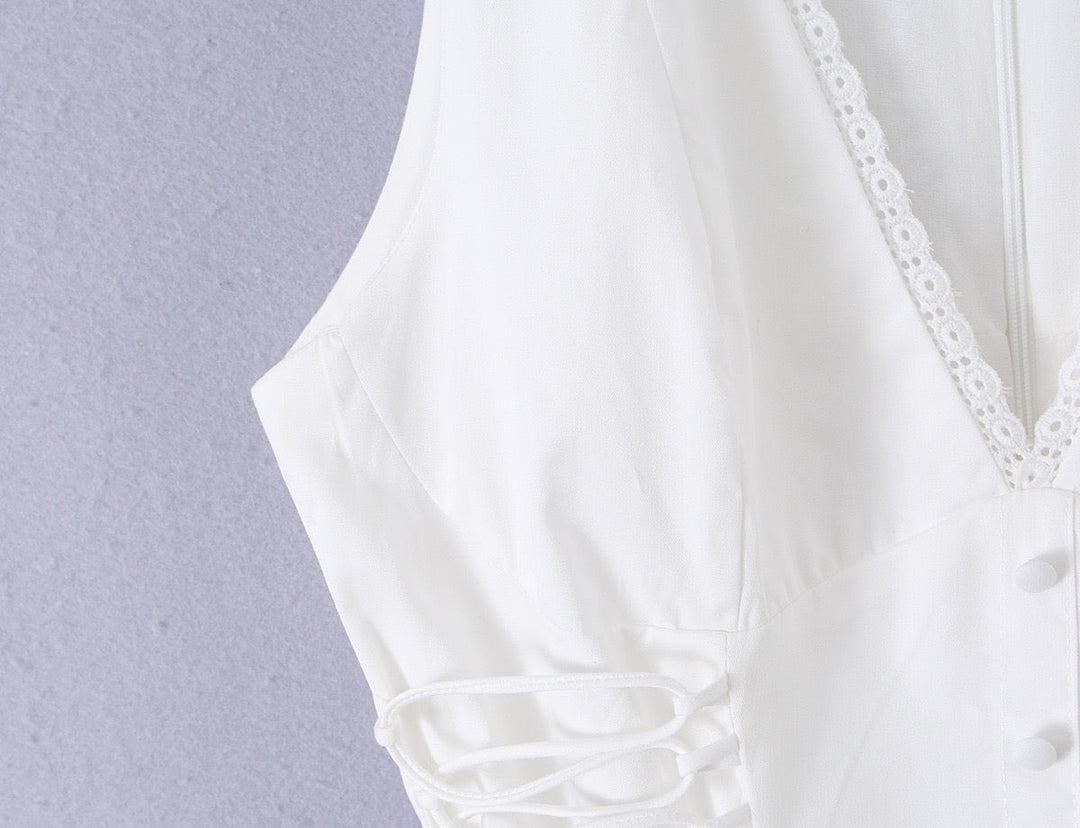 A-line mini dress with tie and button embellishments – Vanessa