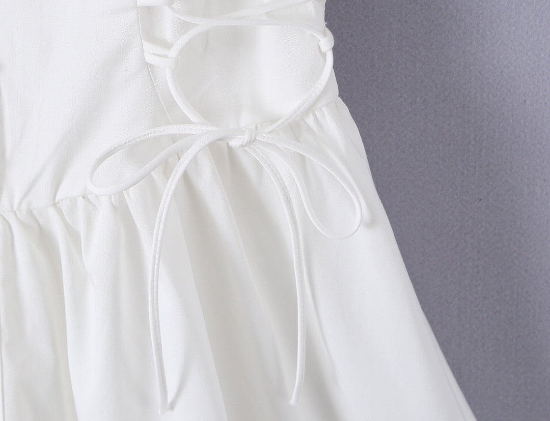 A-line mini dress with tie and button embellishments – Vanessa