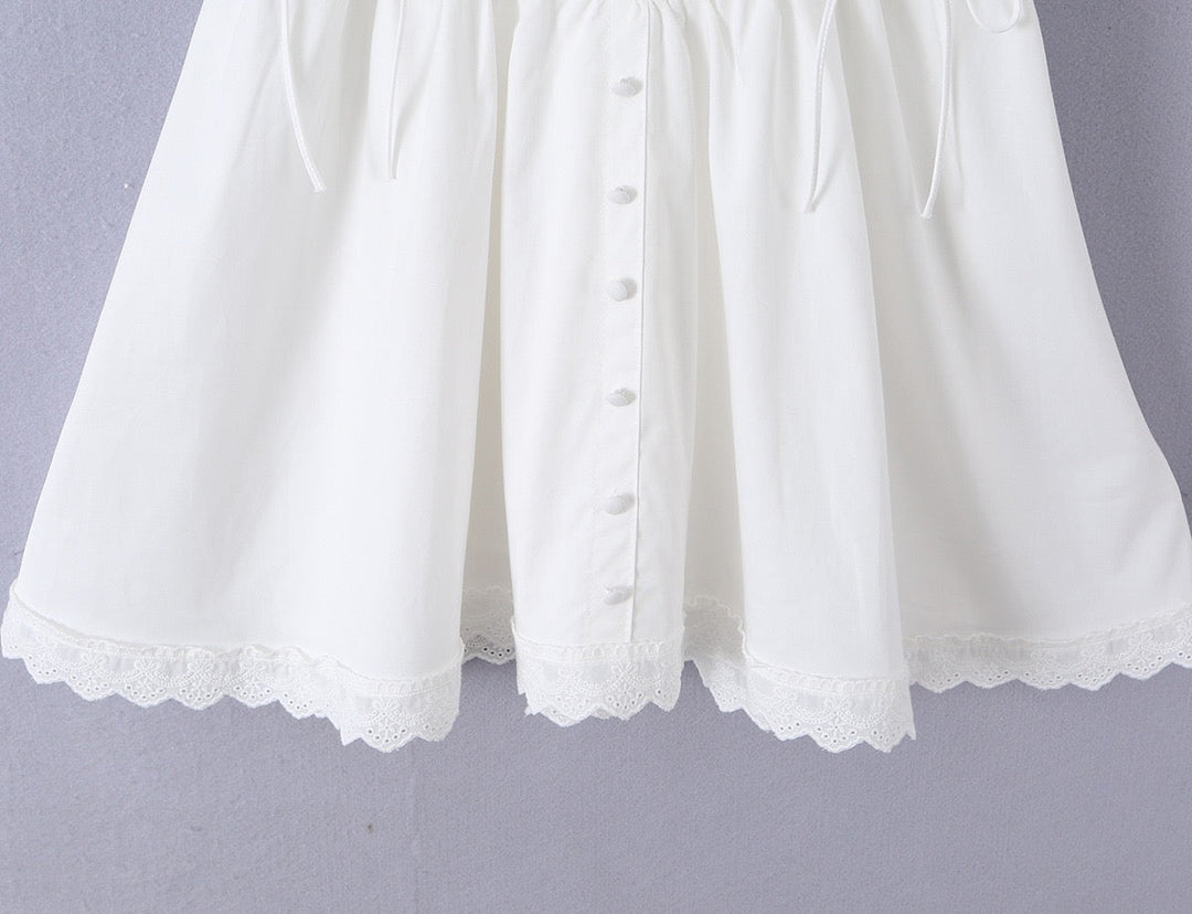A-line mini dress with tie and button embellishments – Vanessa