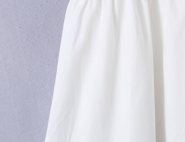 A-line mini dress with tie and button embellishments – Vanessa