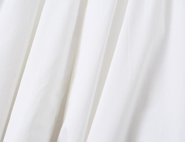 A-line mini dress with tie and button embellishments – Vanessa
