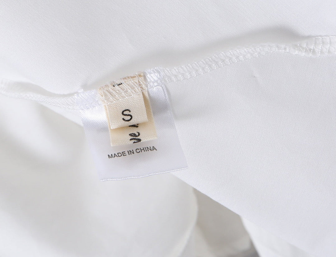 A-line mini dress with tie and button embellishments – Vanessa