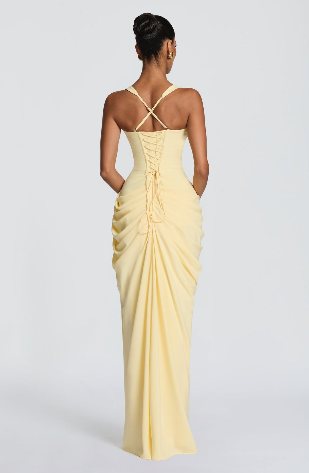 Layla maxi dress with a slit, pleats, corset design, back tie, and waist-cinching fit