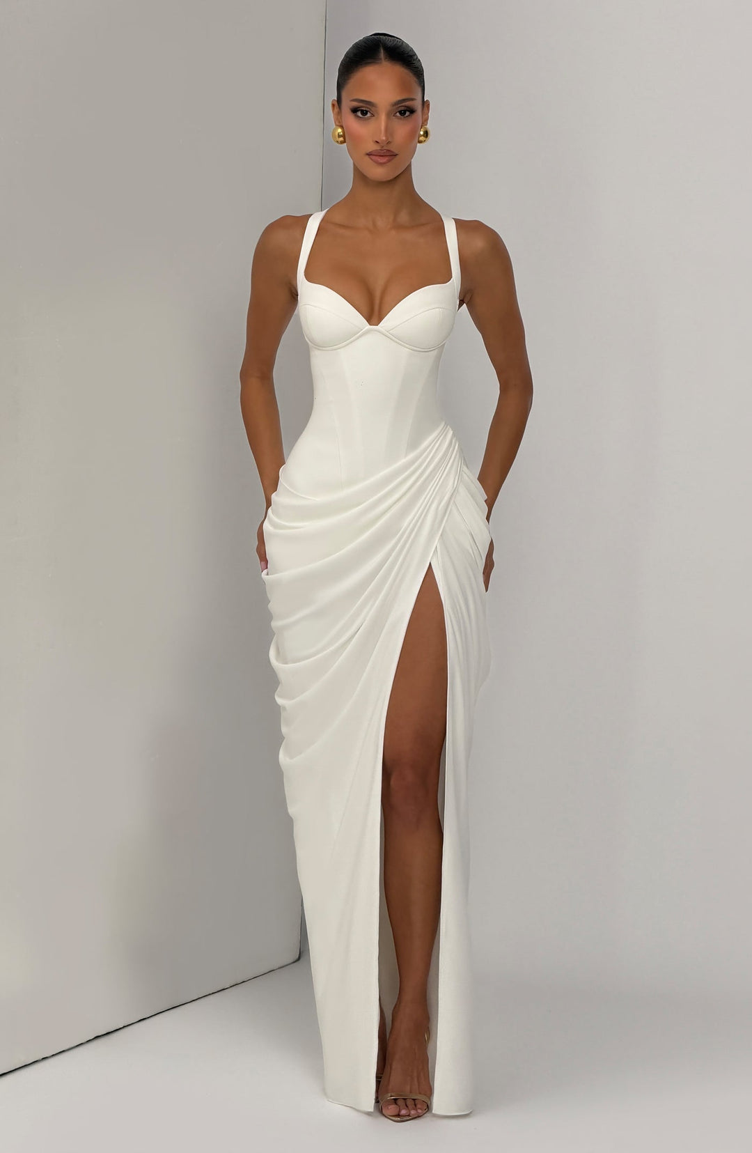 Layla maxi dress with a slit, pleats, corset design, back tie, and waist-cinching fit