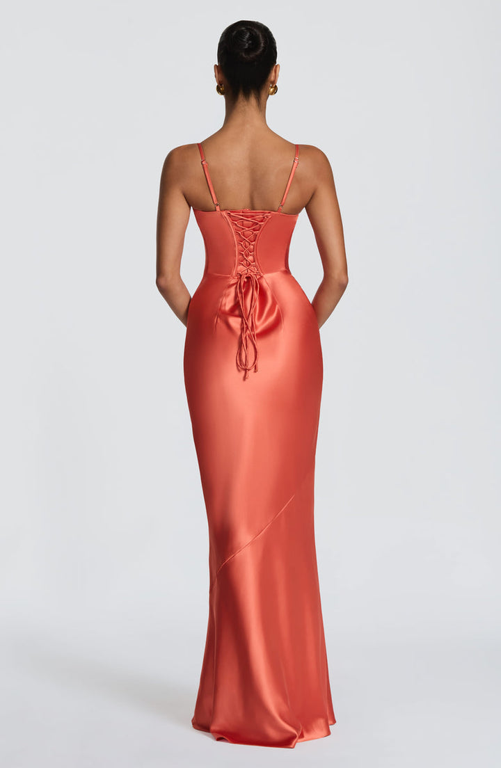 Alaia satin maxi dress with a back tie and waist-cinching design
