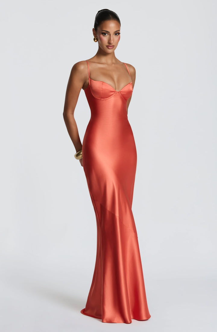 Alaia satin maxi dress with a back tie and waist-cinching design