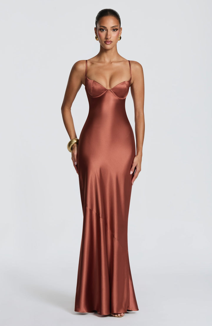 Alaia satin maxi dress with a back tie and waist-cinching design