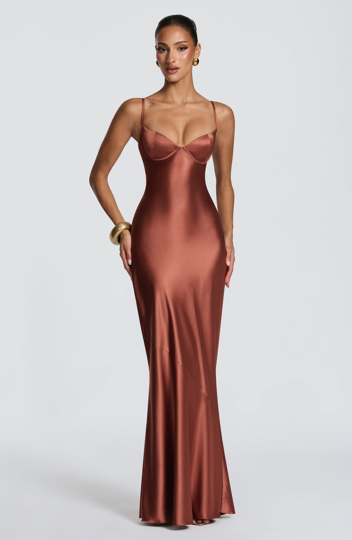 Alaia satin maxi dress with a back tie and waist-cinching design