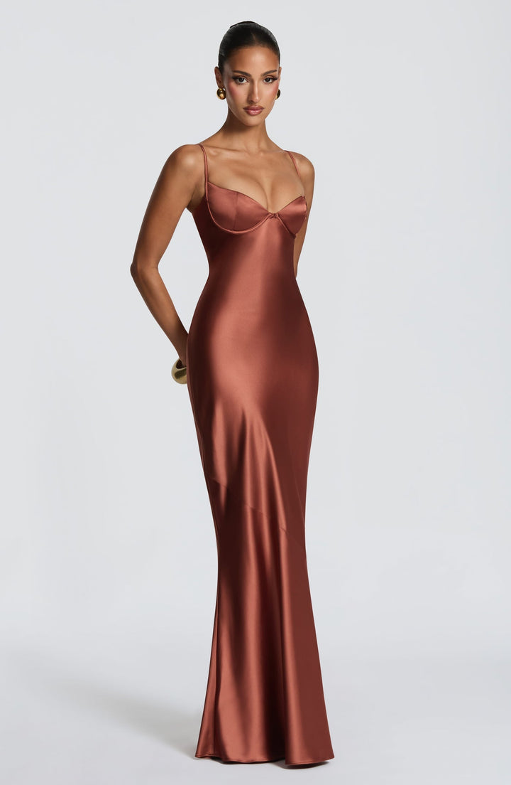 Alaia satin maxi dress with a back tie and waist-cinching design