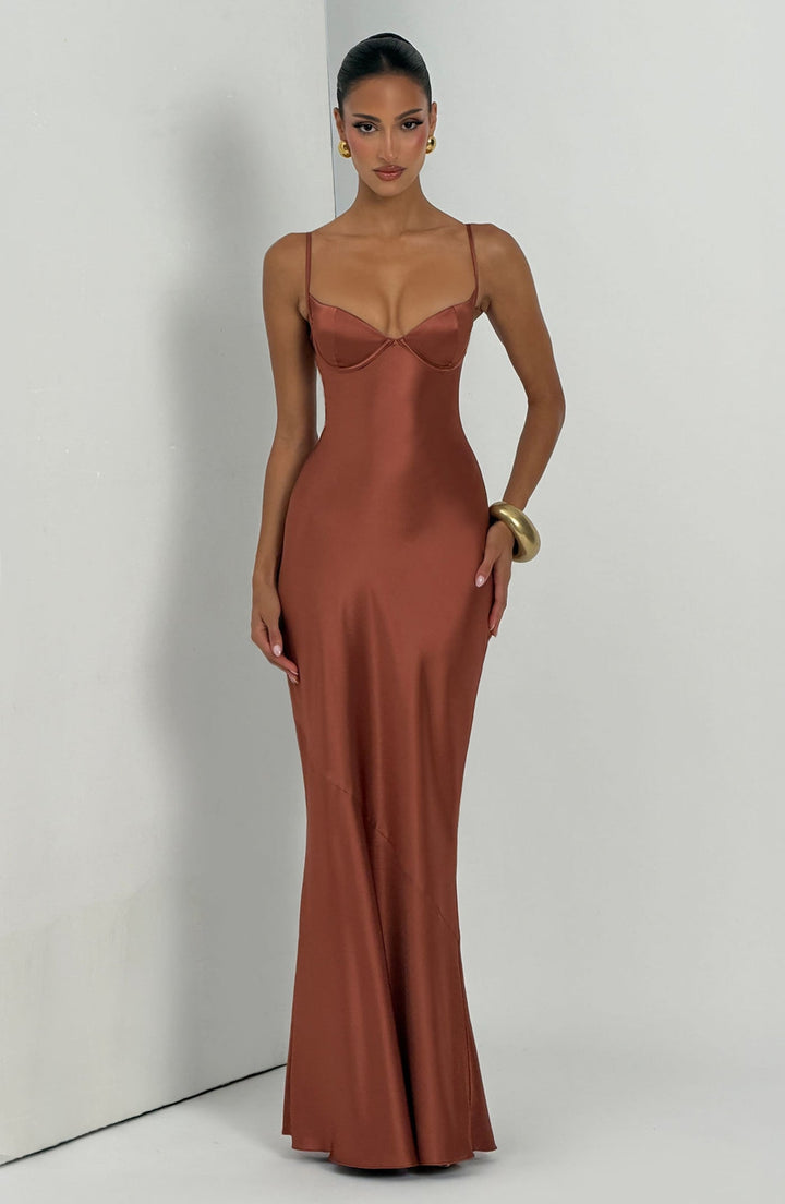 Alaia satin maxi dress with a back tie and waist-cinching design