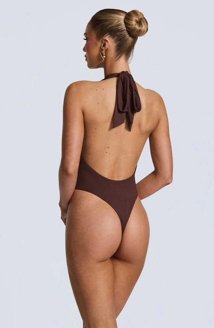 Lorenza - Two-piece set with a halter-tie bodysuit, open back, and asymmetrical skirt