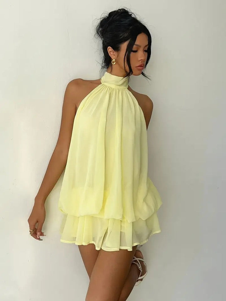 Chiffon ruffled mini dress with tiered ruffles, neck tie, and open back – Seychelles