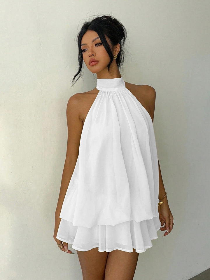 Chiffon ruffled mini dress with tiered ruffles, neck tie, and open back – Seychelles