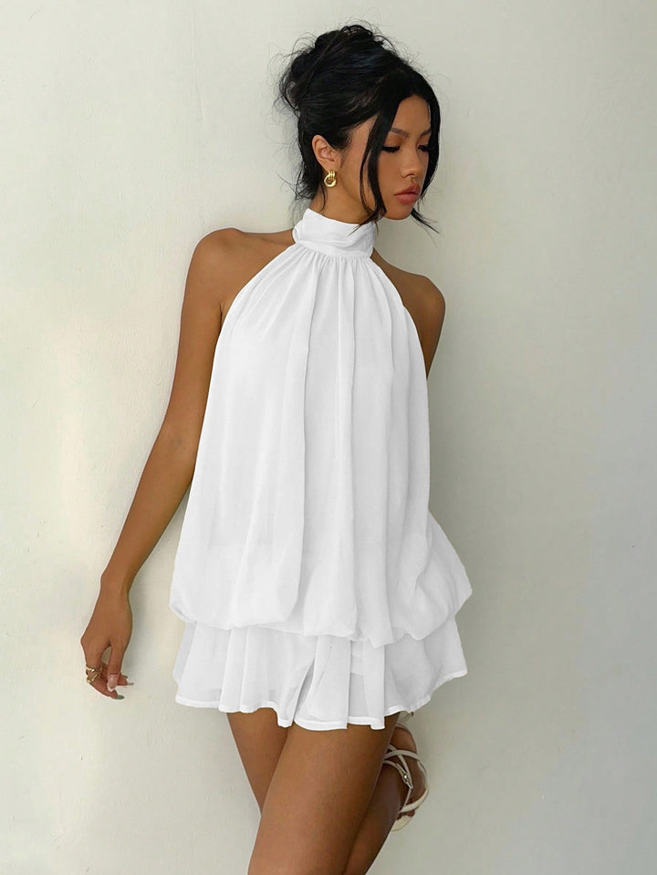 Chiffon ruffled mini dress with tiered ruffles, neck tie, and open back – Seychelles