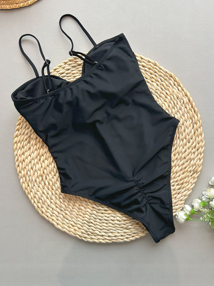 High-waisted one-piece swimsuit with polka-dot design – Bella