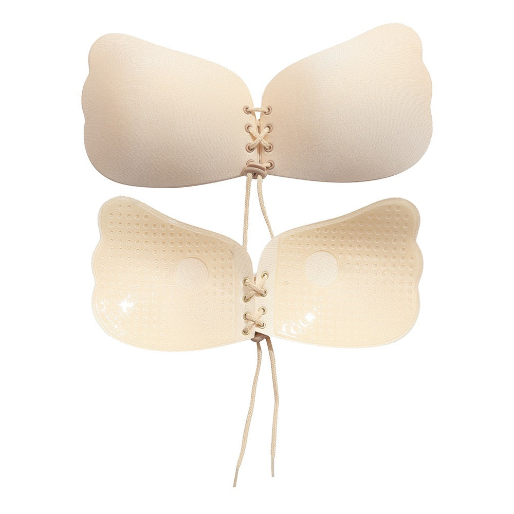 Adhesive strapless bra for securing the breasts