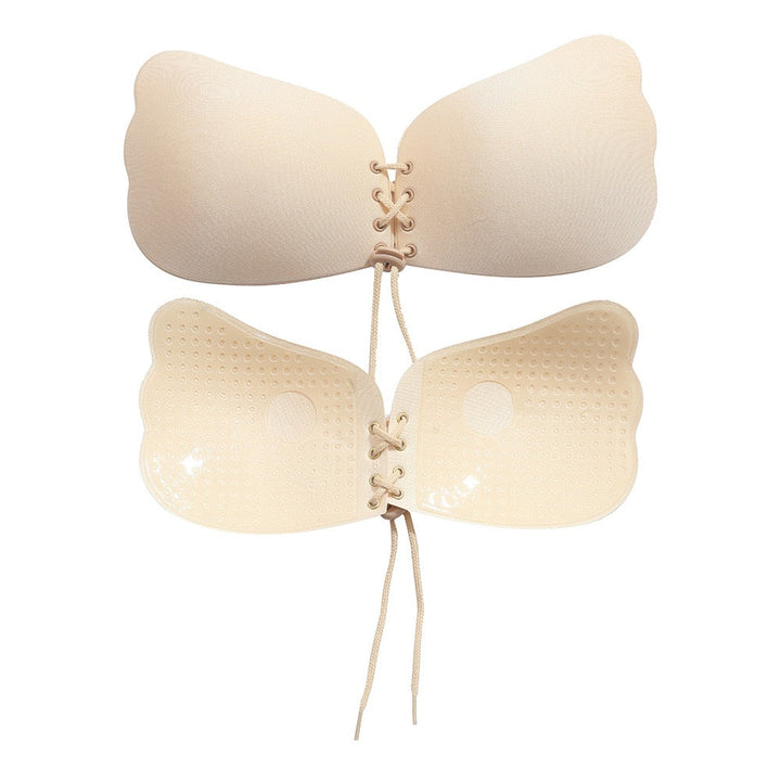 Adhesive strapless bra for securing the breasts