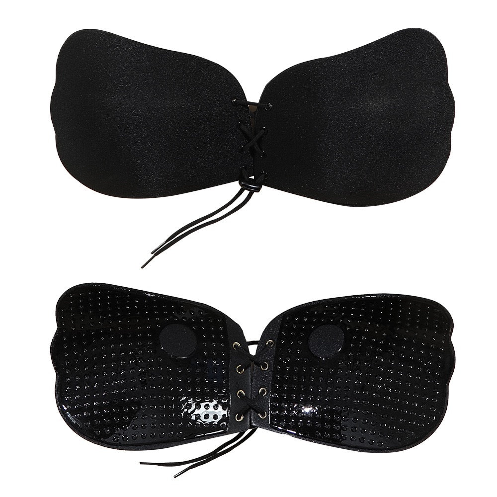 Adhesive strapless bra for securing the breasts
