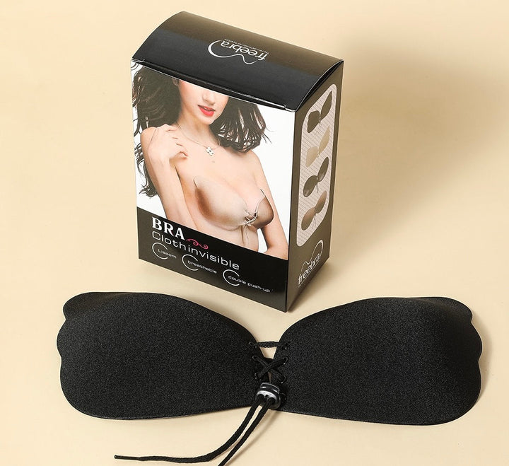 Adhesive strapless bra for securing the breasts