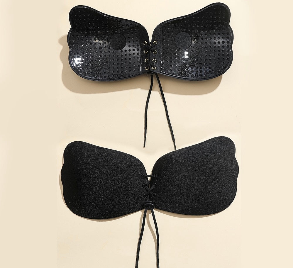 Adhesive strapless bra for securing the breasts