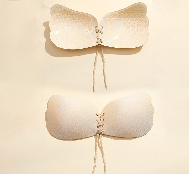 Adhesive strapless bra for securing the breasts