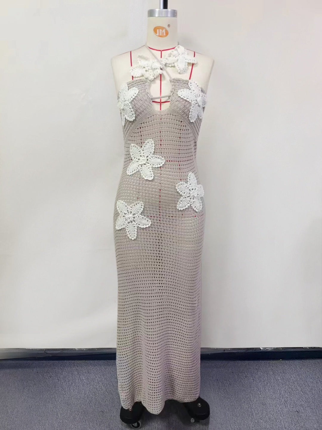 Natalia knitted beach maxi dress with a floral design and open back