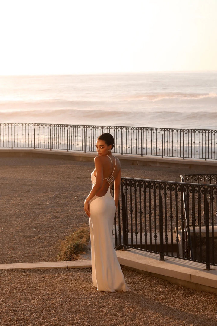Roxania elegant satin maxi dress with a diamond buckle detail on the back