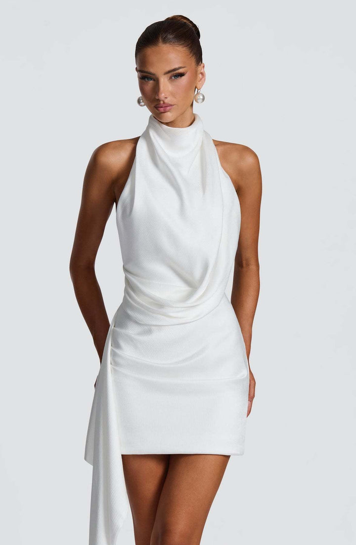 Lilian satin halter mini dress with an open back and train detail