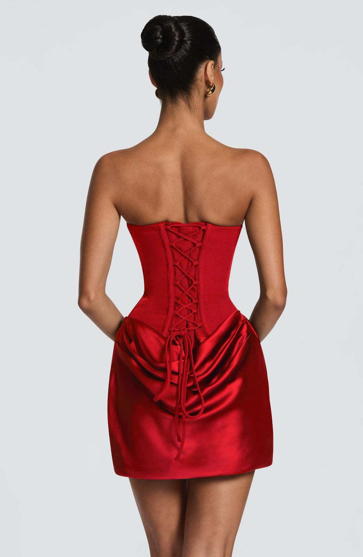 GENNA strapless satin mini dress with pleats, a tie-up corset at the back for a fitted waist, and a scarf detail