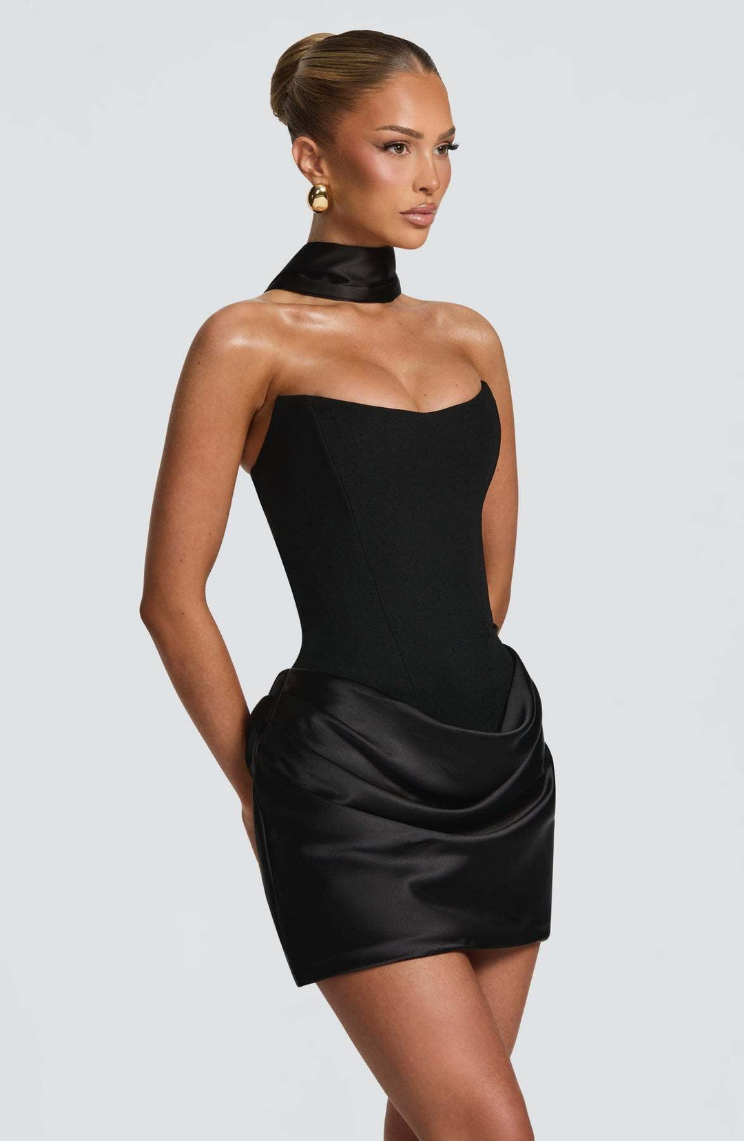 GENNA strapless satin mini dress with pleats, a tie-up corset at the back for a fitted waist, and a scarf detail