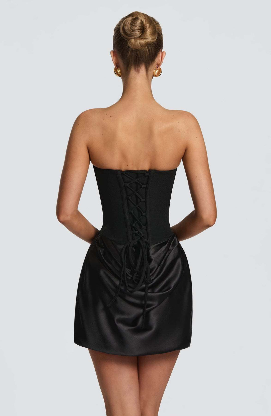 GENNA strapless satin mini dress with pleats, a tie-up corset at the back for a fitted waist, and a scarf detail