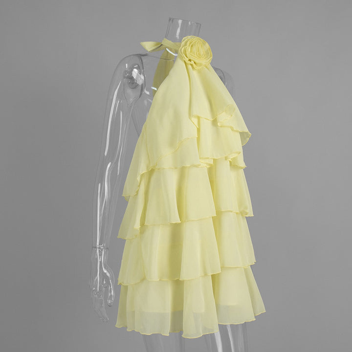 Lily tiered chiffon ruffle mini dress with a neck tie, open back, and floral trim