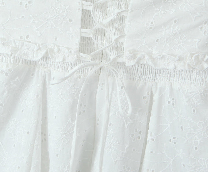 A-line mini dress in embroidered eyelet fabric with back ties for a fitted waist – Vנס