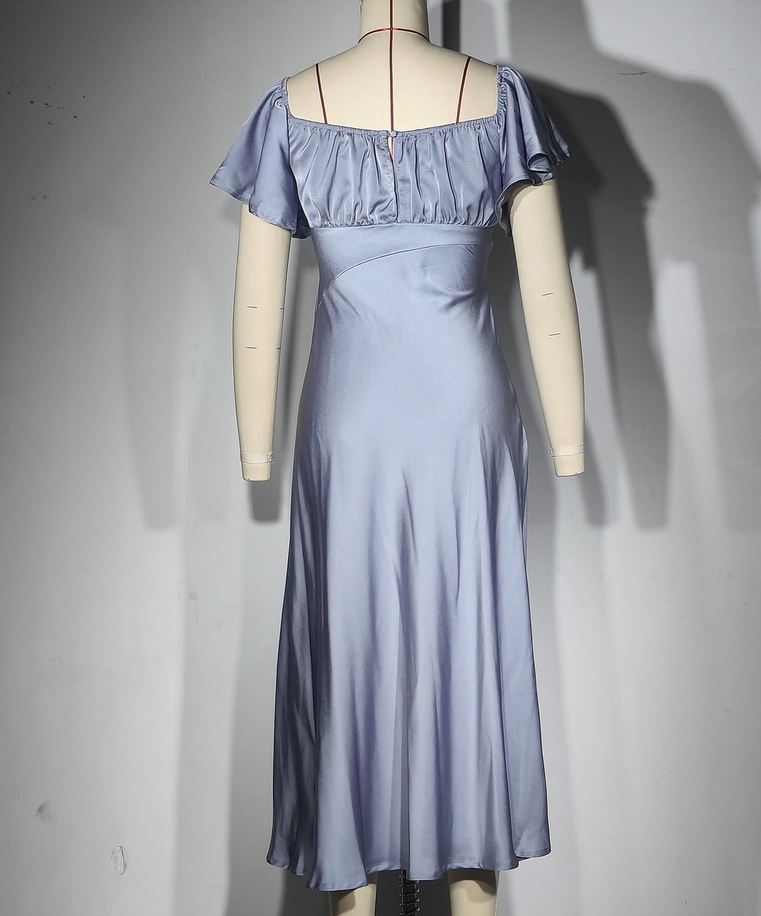 Koren satin midi dress with an off-the-shoulder design