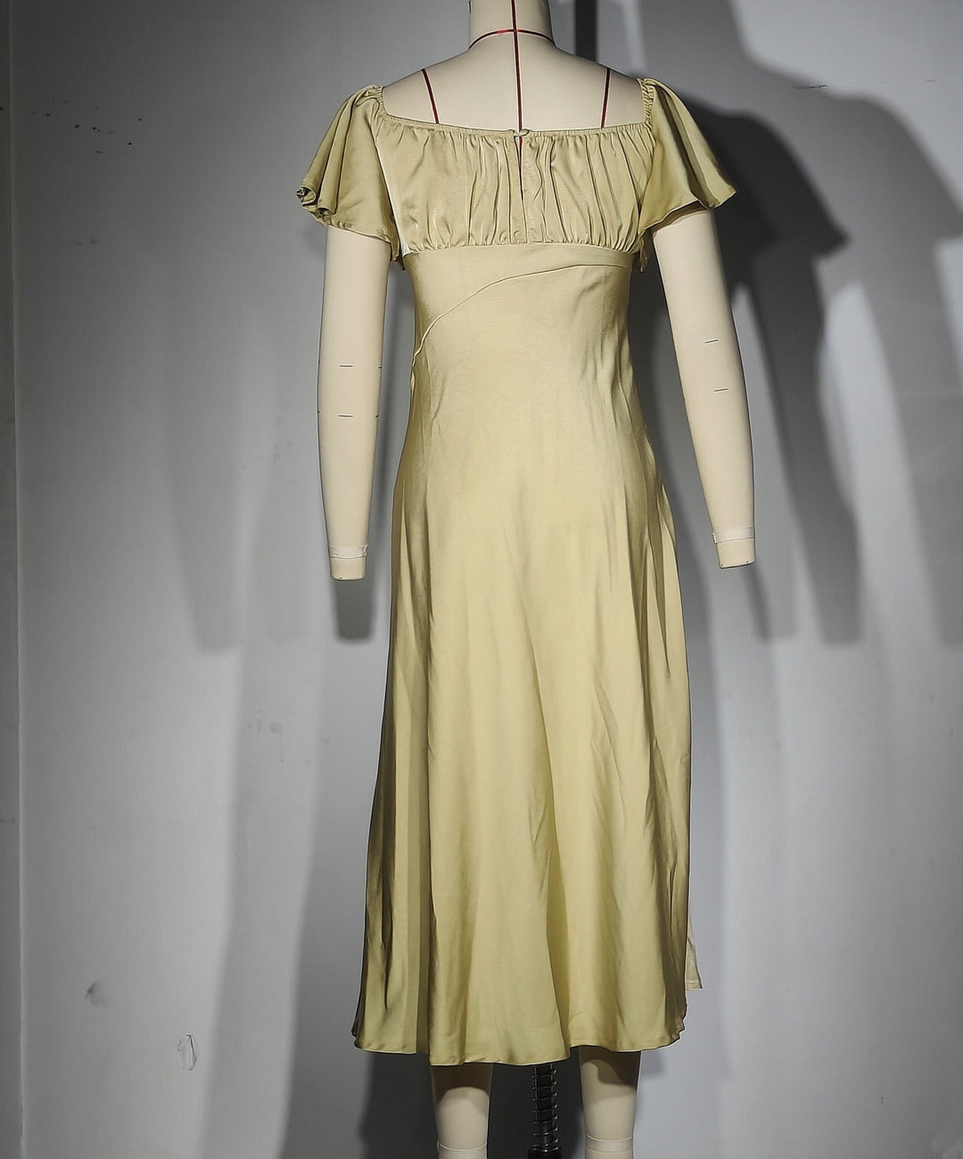 Koren satin midi dress with an off-the-shoulder design