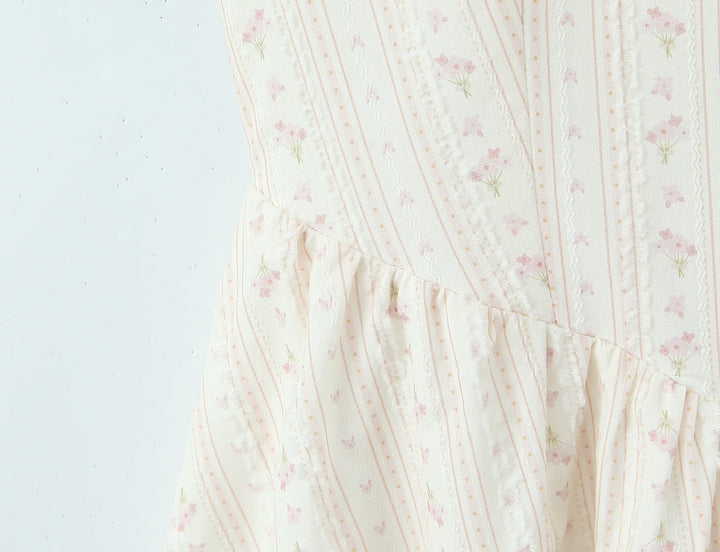 Floral A-line mini dress with an open back – Nelly