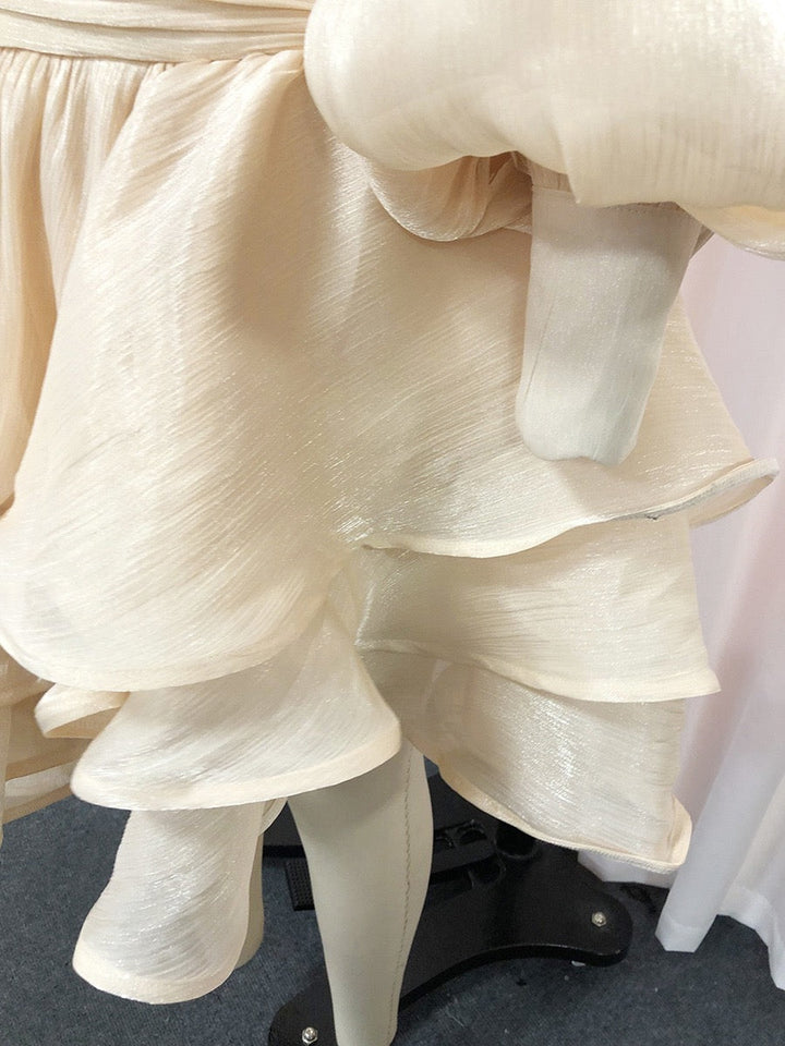 Luciela ruched chiffon ruffle mini dress with a shiny fabric and button trim