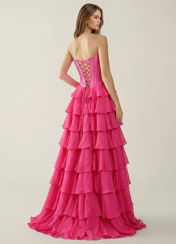 SHERY strapless ruffle maxi dress with a corset design, back tie, waist-cinching fit, and slit