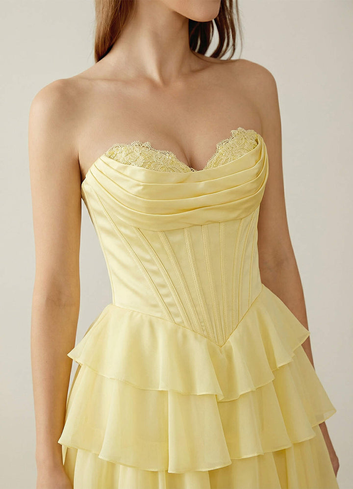 SHERY strapless ruffle maxi dress with a corset design, back tie, waist-cinching fit, and slit