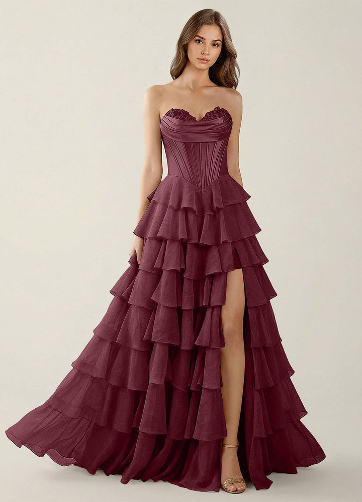 SHERY strapless ruffle maxi dress with a corset design, back tie, waist-cinching fit, and slit