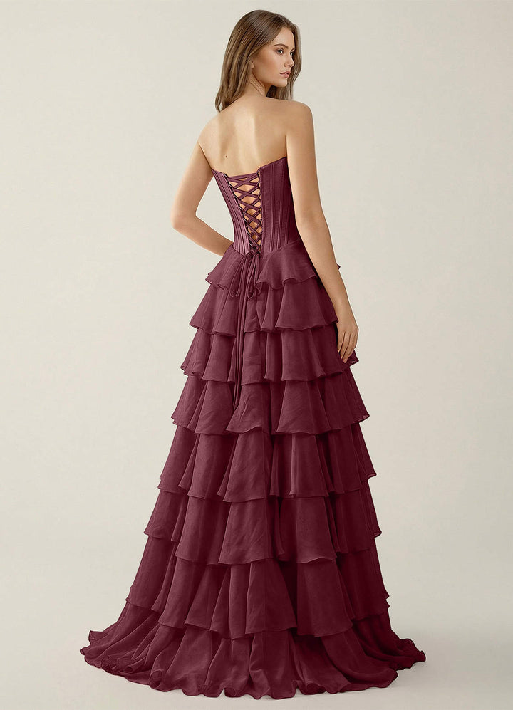 SHERY strapless ruffle maxi dress with a corset design, back tie, waist-cinching fit, and slit