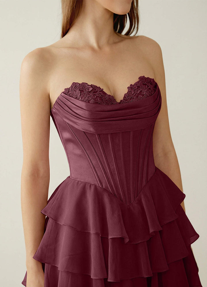 SHERY strapless ruffle maxi dress with a corset design, back tie, waist-cinching fit, and slit